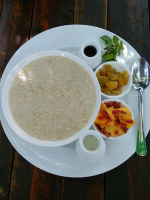 Oatmeal on the water with fruits and honey at Green Queen Cafe  in Mui Ne