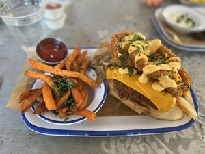 The Gatsby!!!  The Capetonian topped with Beyond chicken, crispy fried onion rings, cheese, and the works.  The star of the show, those onion rings!!!  at Oh My Soul in Charlotte