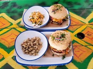 Hippie Chick Vurger with street elote and Waka Waka Burger with chicken curry. at Oh My Soul in Charlotte