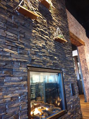 Double sided fireplace at New Holland Coffee Co in New Holland
