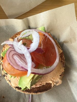 Coast to coast with tomato and herb cream cheese, on an onion bagel  at Seize the Bagel in Vancouver