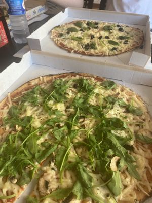 The vegan and a custom pizza with vegan cheese   at Pizza 44 in Setubal