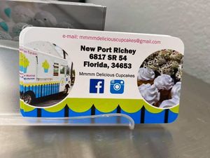 Business card and owner info at Mmmm Delicious Cupcakes in New Port Richey