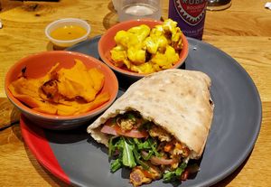 Veggie burger pita, charred sweet potato, tumeric cauliflower at Nandos Peri Peri in Oak Brook