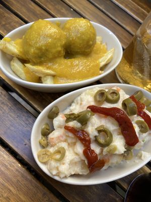 Albondigas in an almond sauce and ensaladilla rusa. 2,5 euros each! at La Vegana Taperia in Malaga