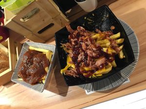 Patatas con vegan cheese and albondigas at La Vegana Taperia in Malaga