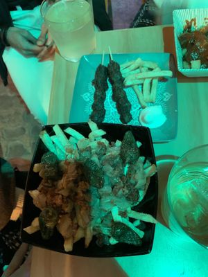 Loaded fries and Indian skewers  at La Vegana Taperia in Malaga