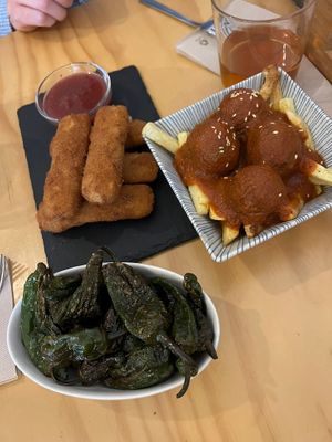 Cheese croquettes, fried (non-spicy) peppers and meatballs in tomato sauce at La Vegana Taperia in Malaga