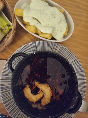 The (almost gone) gambas pil pil and the patatas alioli at La Vegana Taperia in Malaga