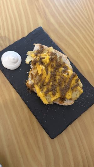 Potatoes on bread with chimichurri saucee  at La Vegana Taperia in Malaga