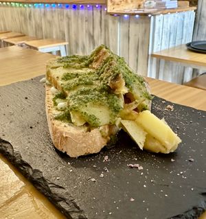Potato with garlic sauce on breadd  at La Vegana Taperia in Malaga