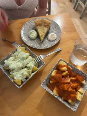 Patatas bravas, potatoes with garlic sauce and tortilla española. Would recommend asking for patatas bravas with extra garlic sauce instead of 2 dishes at La Vegana Taperia in Malaga