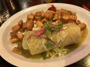 burrito with green sauce and potatoes  at Carlos 'N Charlie's in Las Vegas