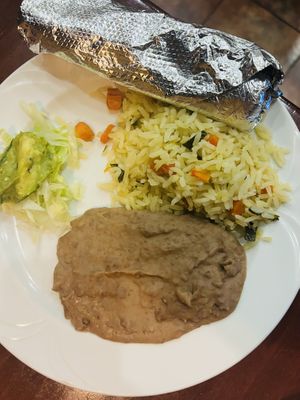 This is the “side of guacamole” rice and beans. Two small tortillas for the fajitas. Very small portion.  at Paulina's Mexican Grill in Victorville