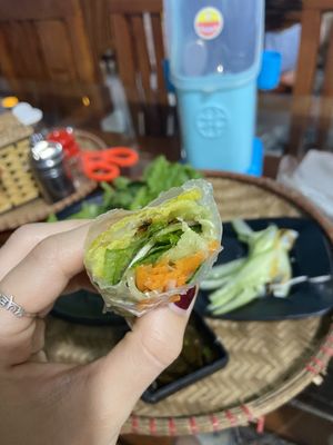 The proper way to roll it! (I had to watch a YouTube video) put the pancake inside the rice paper roll!!!  at Thuy Di Quan My Quang in Ha Giang