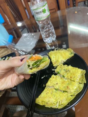 A thin pancake with bean sprouts fried inside for the vegan option😄 extra greens and pickled veg on the side. Rice paper included too😄all for 30k   at Thuy Di Quan My Quang in Ha Giang