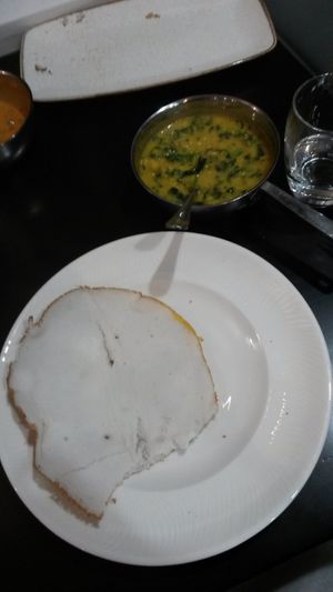 Appam bread with the cheera parippu curry, both mouth-wateringly good. at Kalpakavadi in York