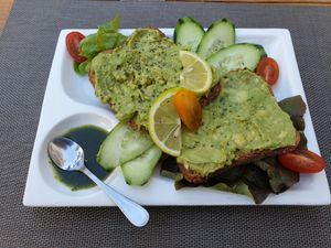 Toast with mashed avocado at Adam's Cafe in Tamraght
