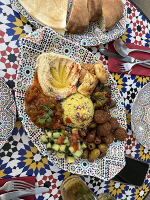 The big mezze plate for 2 (the puff pastries next to the hummus are NOT vegan, and were given to us by mistake)   at Barbès Bar in Luzern