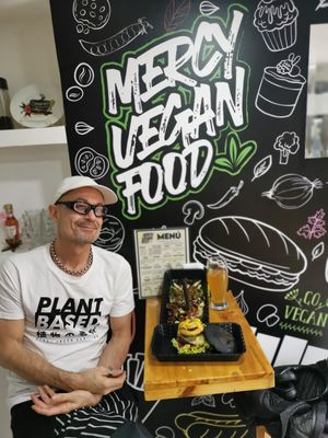 Me and the sign at Mercy Vegan Food in Bogota