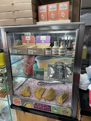 Glass case with goodies  at Mercy Vegan Food in Bogota