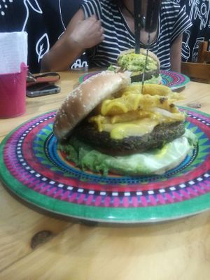 Burger con onion rings at Mercy Vegan Food in Bogota