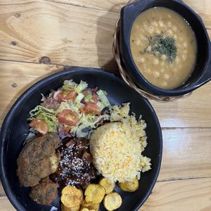 Menú del día: fried broccoli, creole potatoes, salad, BBQ tofu and chickpea soup. Came with agua de panela.   at Mercy Vegan Food in Bogota