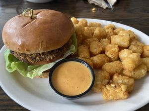 Veggie burger with tater tots   at The Village Inn in Gambier