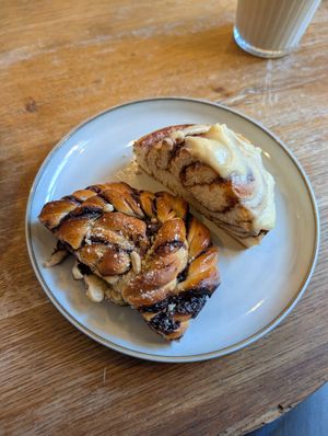 Bakes - cinnamon bun with frosting and chocolate bake. at Szklarnia in Krakow