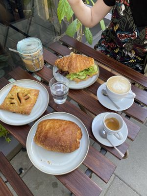 Pain au chocolat, french dough with spinach and tofu, sandwich with “egg” pate at Szklarnia in Krakow