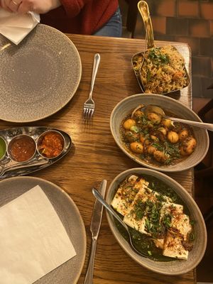 Rice with veggies and herbs, potato curry, spinach and tofu curry  at Namaste Holborn in London