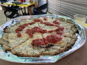 Gluten free vegan cauliflower crust “cheese” pizza. Everything made in house and delicious!  at Pedaler's Pub in Bentonville