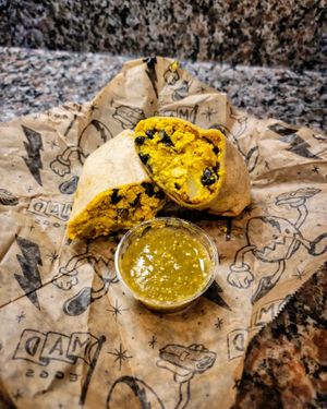 Happy Cow Breakfast Burrito with Black Beans and Salsa Verde at Rise Up Coffee in Rehoboth Beach