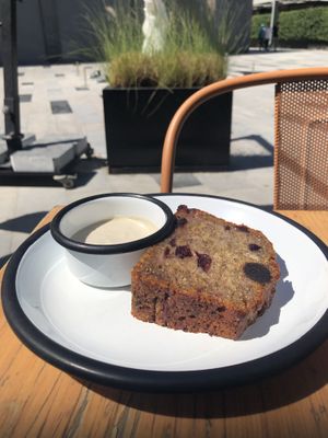 Banana and cranberry bread with cream   at Wild & The Moon - DIFC in Dubai