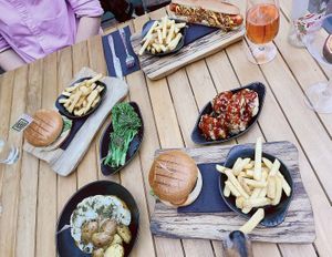 Vegan burgers & hotdog, cauli steak, cauli poppers, greens & a chip thief!  at The Fig in Malvern