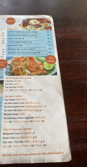 Menu (March 2024). Note: V sign is for vegetarian, vegan is not listed.   at The Backyard Cafe & Bistro in Koh Lanta