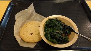 Freakishly delicious kale and a choc chip cookie. :) at Good Foods Market and Cafe in Lexington