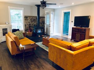 The spacious, yet cozy living room leads to the backyard, deck and hot tub. at Terra in Colborne