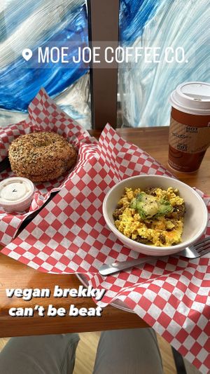 Everything bagel with FANTASTIC vegan cream cheese, oat milk latte, and the veganized breakfast bowl  at Moe Joe in Clemson