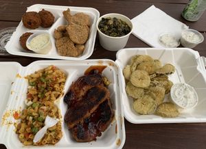 Hush puppies, fried 'catfish', collards, house ranch, BBQ 'ribs', friend pickles, spicy Mac & chz. 😋  at Dirty Lettuce in Portland