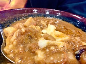 Peanut vegan over fufu with Sav’s hot sauce. at Sav's in Lexington