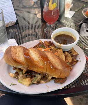 Vegan Banh Mi with fries and pomegranate ginger spritz  at Ramsi's Cafe on the World in Louisville
