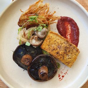 Wild mushrooms on toast with tofu and avo in place of eggs. at Two Blocks Cafe in Holloways Beach