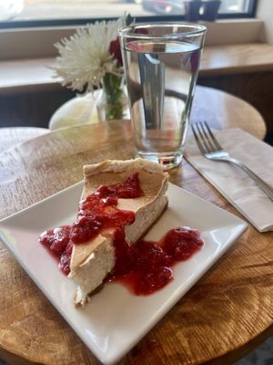 Vegan Cheesecake with graham cracker crust, strawberry, rhubarb, pinelake cellar compote.  at Box Bar in West Seattle