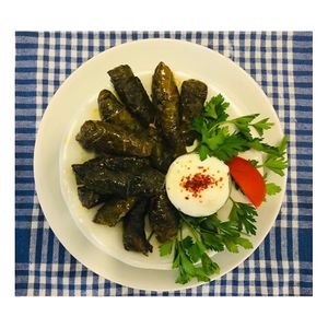 You can call it “Yaprak Sarma” or “Dolma”. It is a Turkish traditional meal. It is made by wrapping a grape or cabbage leaf around rice with spices. at Hanimeli in Istanbul