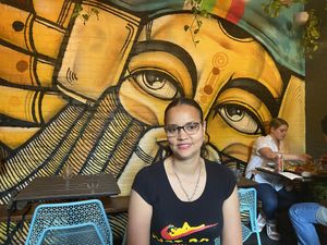 My lady waiting to eat at Ras Plant Based in Brooklyn