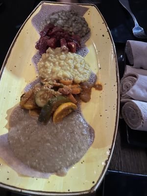 My pictures disn’t turn oit great, was concentrating dinner. This is one of the combos, in real life looks much better. at Ras Plant Based in Brooklyn