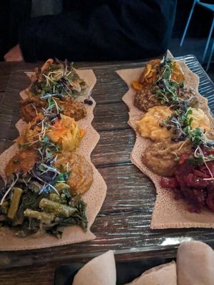 Both platters (mercato on the left and piassa on right) at Ras Plant Based in Brooklyn