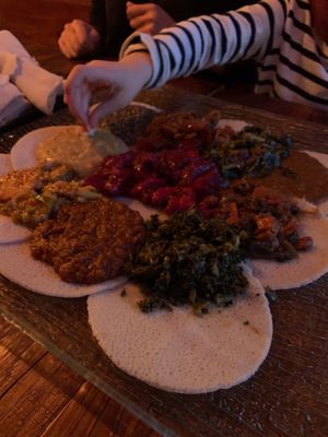 Food served Injera Bread at Ras Plant Based in Brooklyn