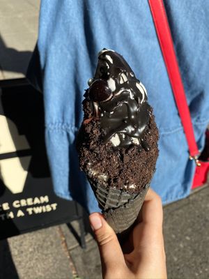 Bourbon soaked cherries, chocolate drizzle, Oreo crumbs, charcoal cone, and oat milk soft serve! at PERVERTED in Vancouver